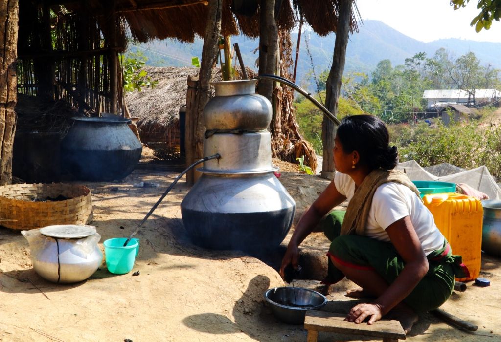 A woman from Loi community makes local liquor in Andro, Manipur_groundupstories