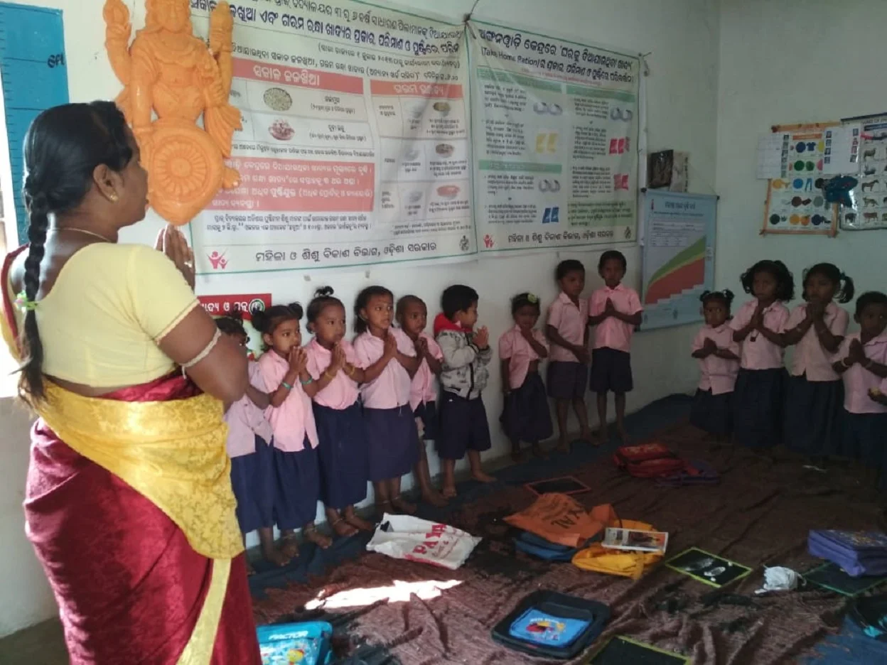 Young children in school uniform,praying