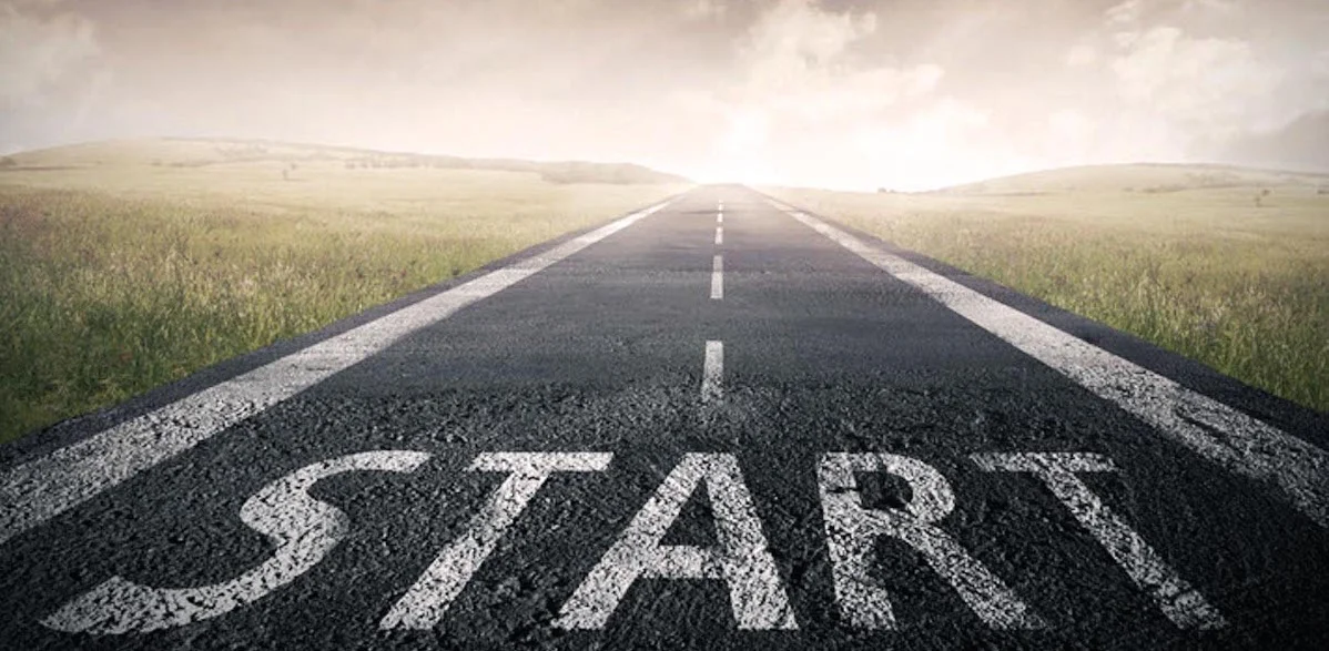 long empty road with a START sign