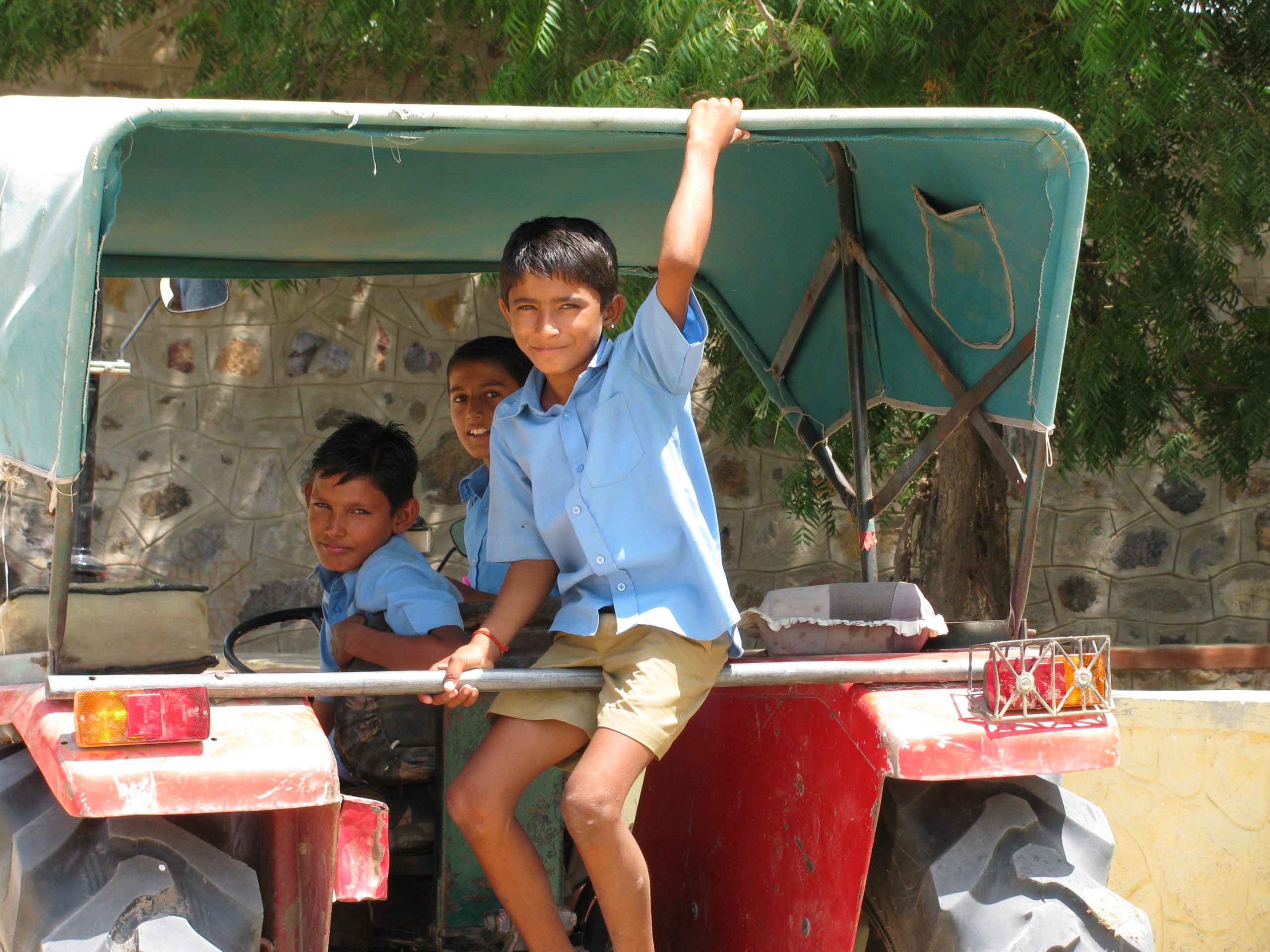 Social sector fellowships boys sitting on the back of a truck in rajasthan