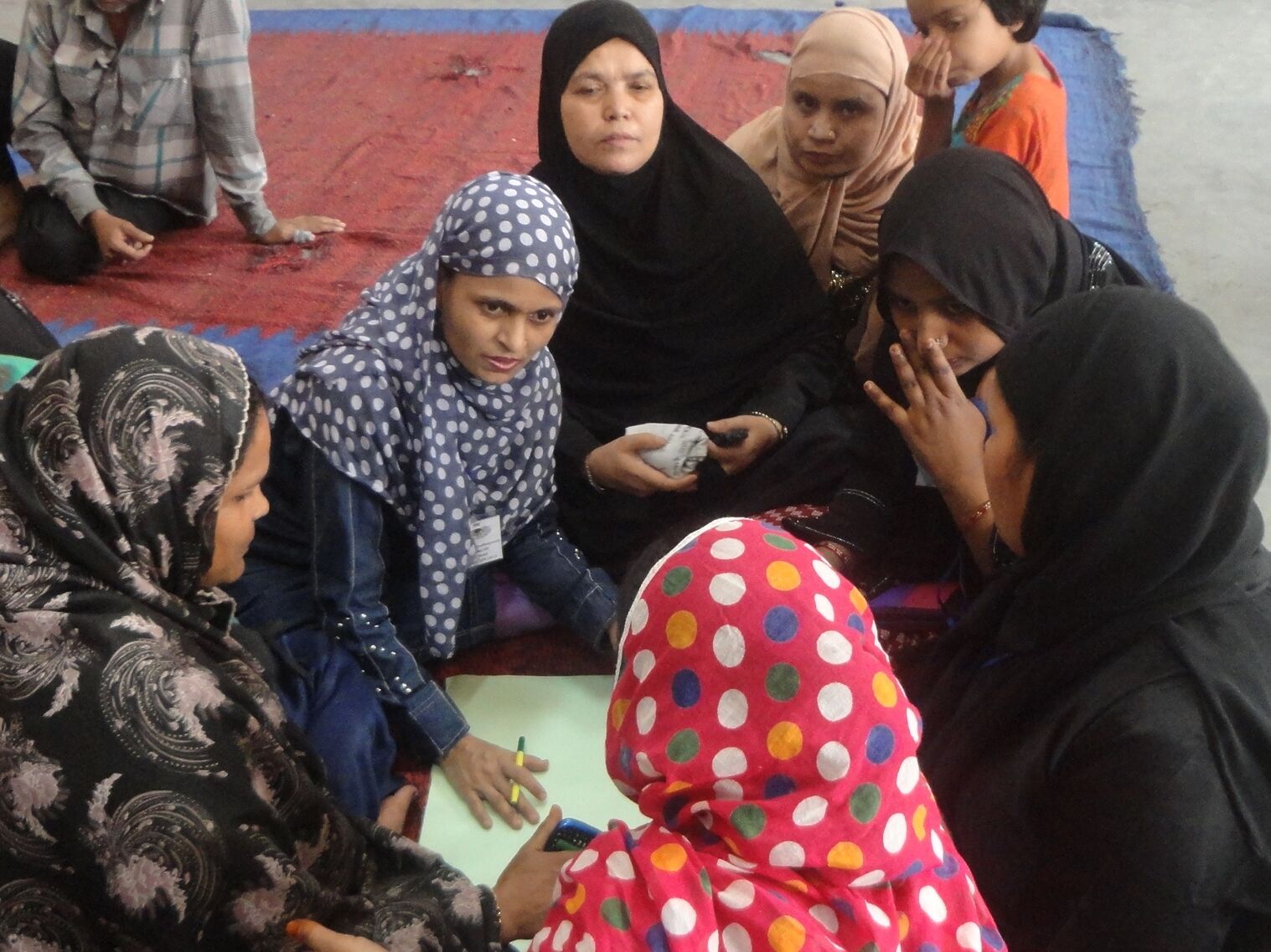 Burkha clad women discussing amongst themselves