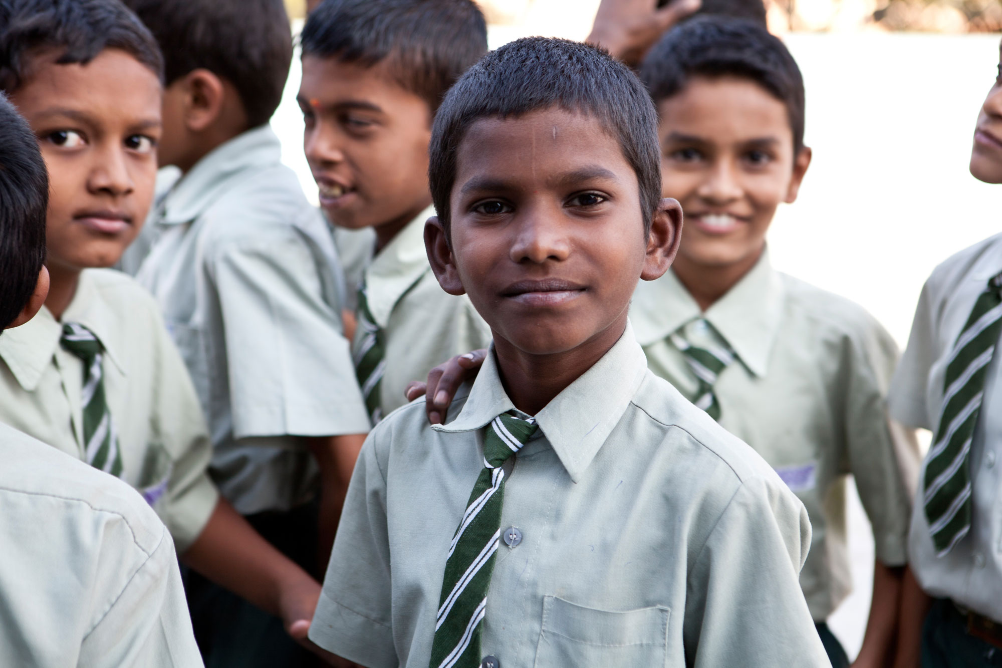 A young school boy smiling