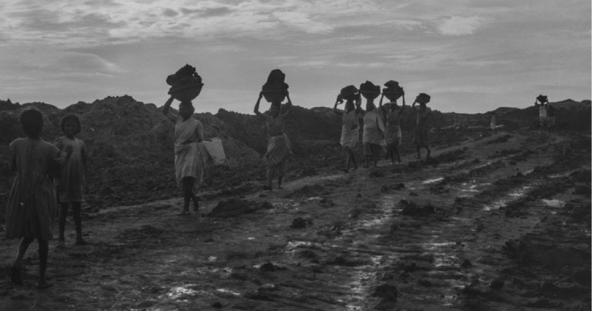 A group of women carrying some load in baskets