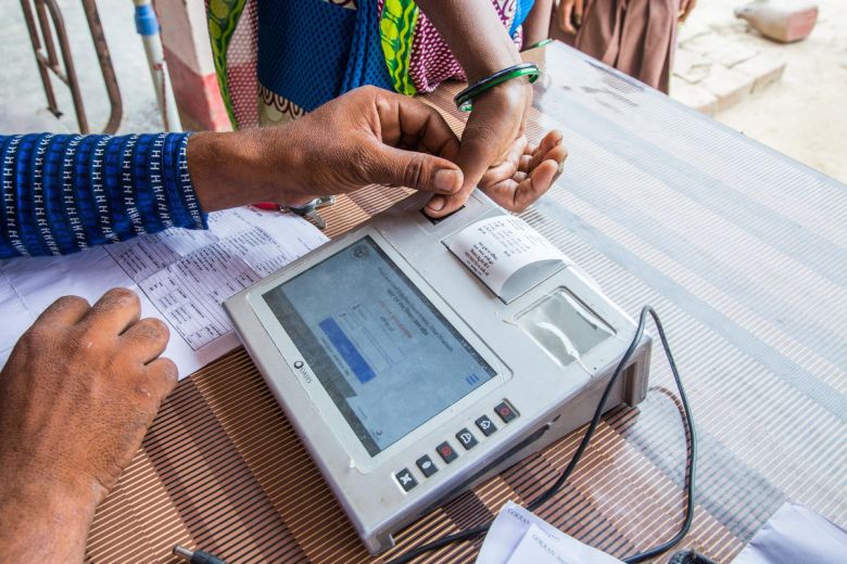 closeup of man using biometrics for PDS_©Gates Archive_Prashant Panjiar