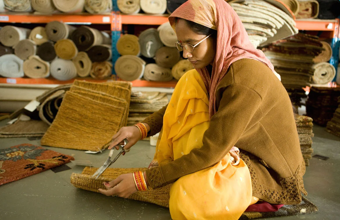 woman weaving mats financial inclusion