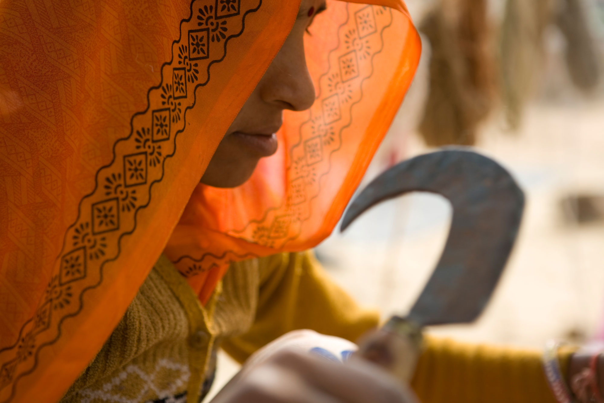 A woman holding a working tool