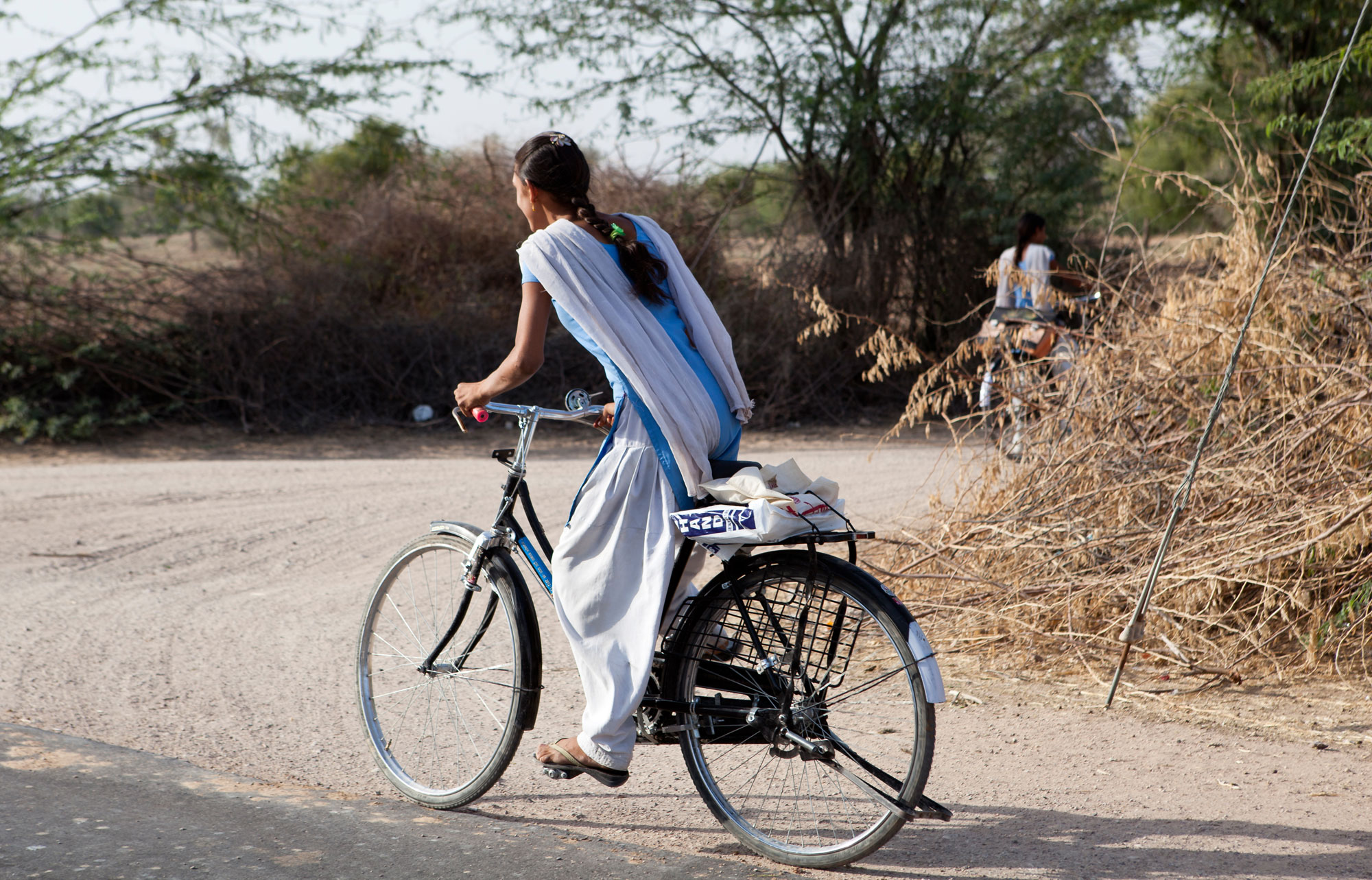 adolescent girl riding a bicycle