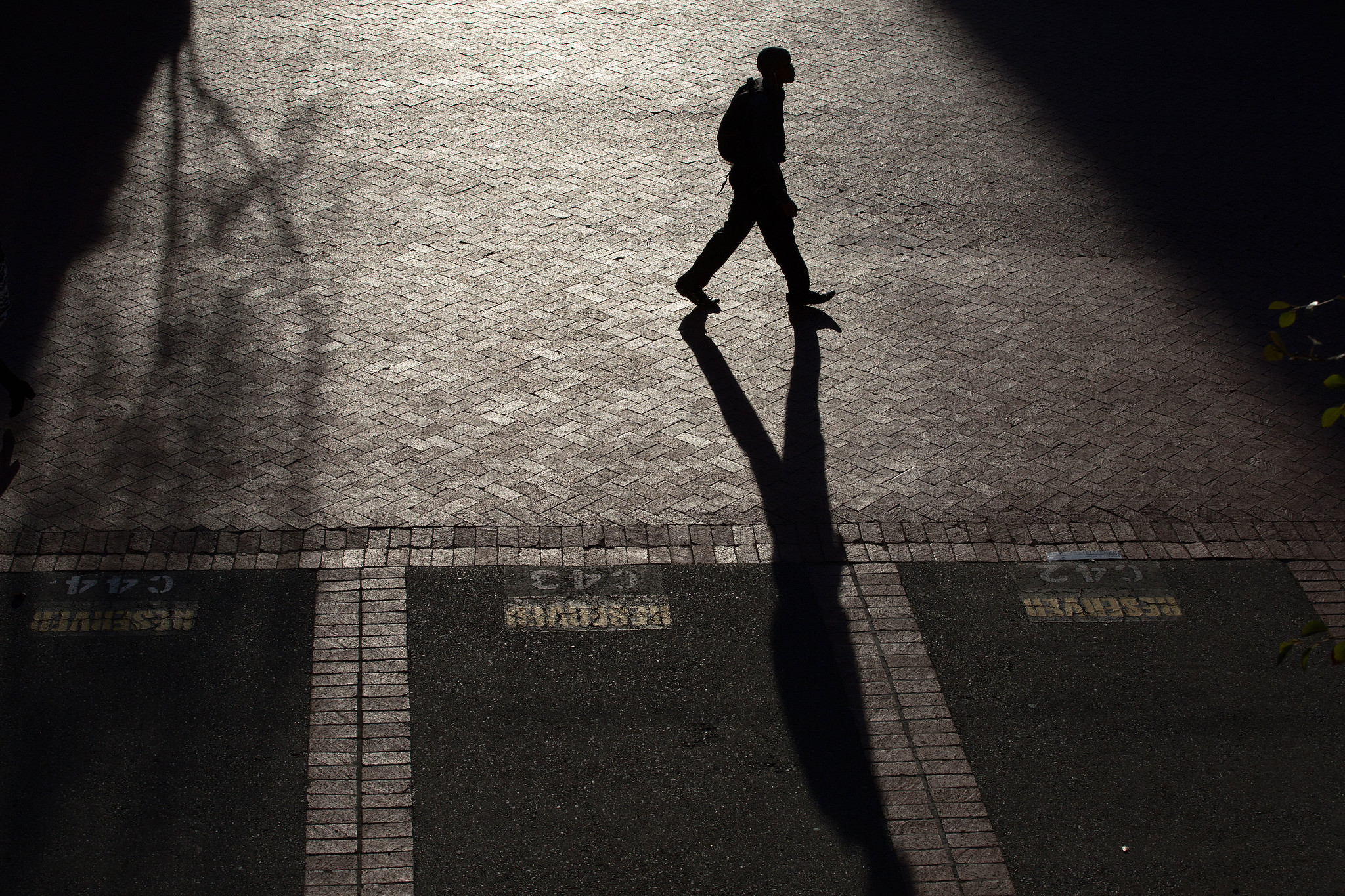 A man walking at night on the road