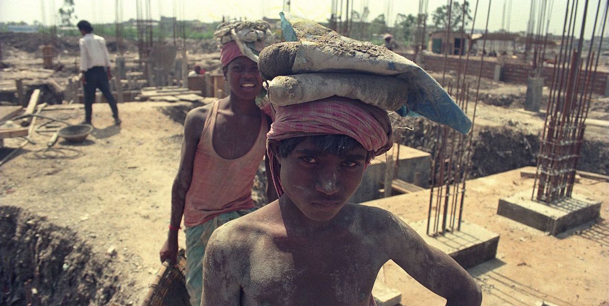 Young boys working on a construction site