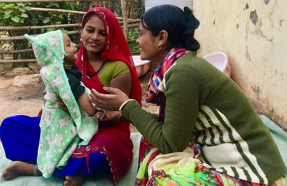 a community health worker with a mother and her child-frontline community health workers_COVID-19-picture courtesy: Sajju Meena