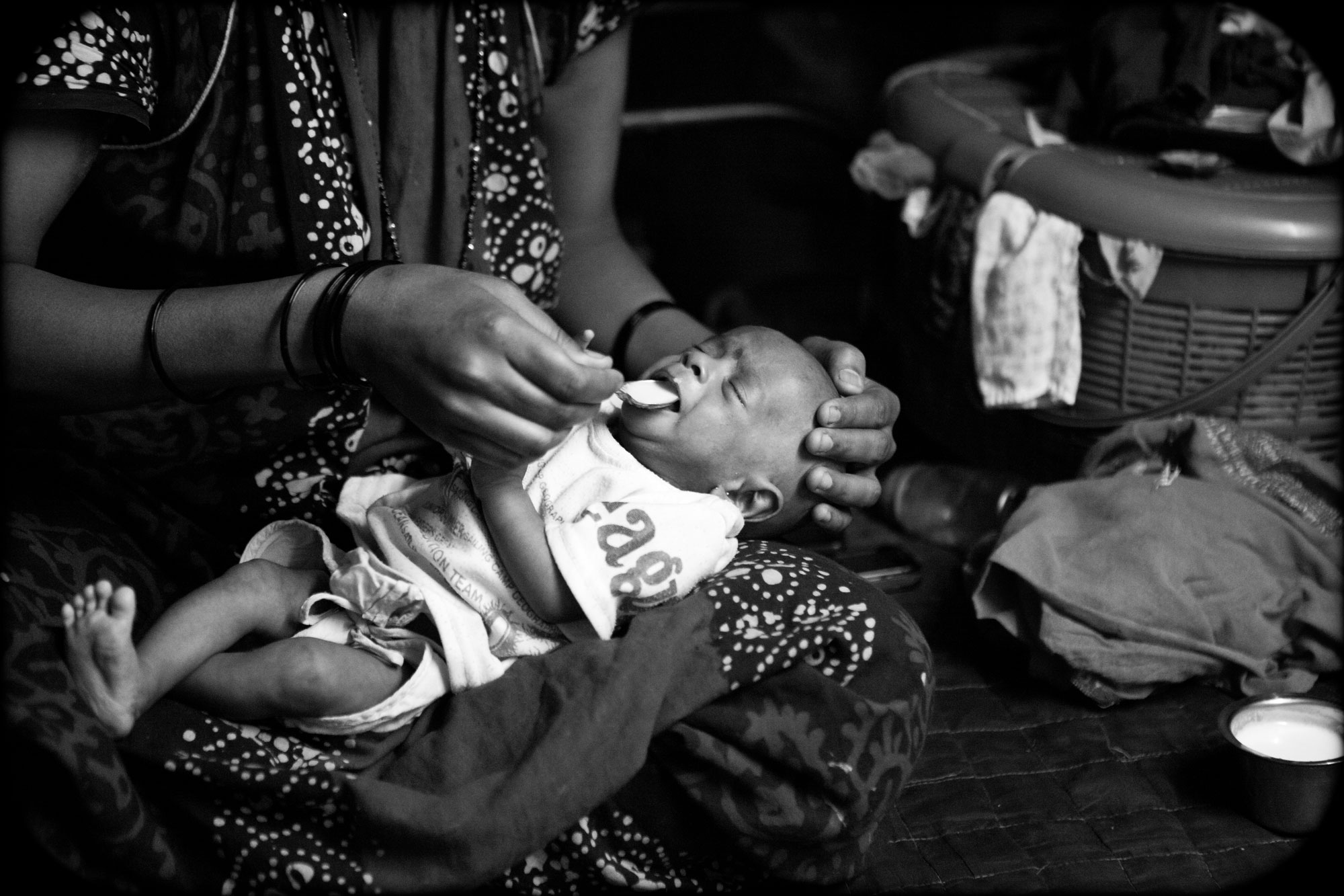 baby being fed milk