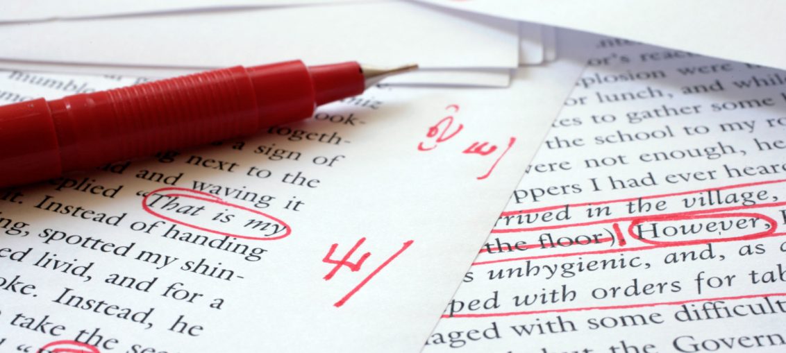 Text being edited with a red pen_Wikimedia Commons