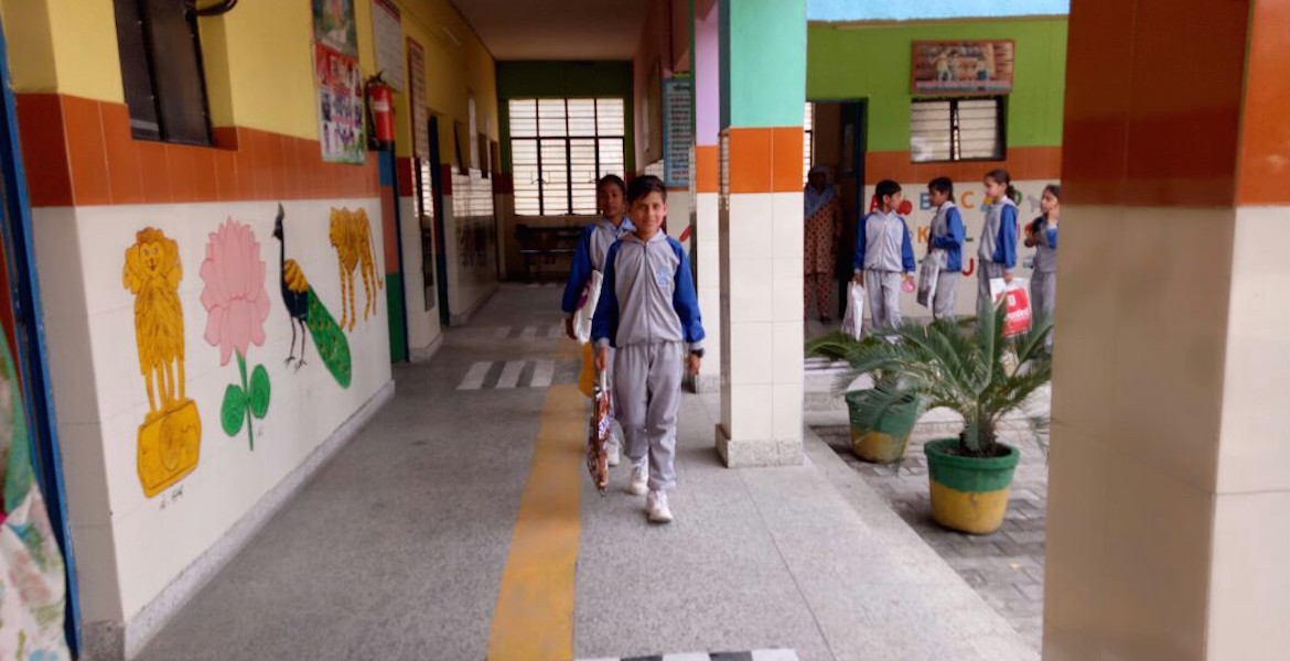 Boy walking in school