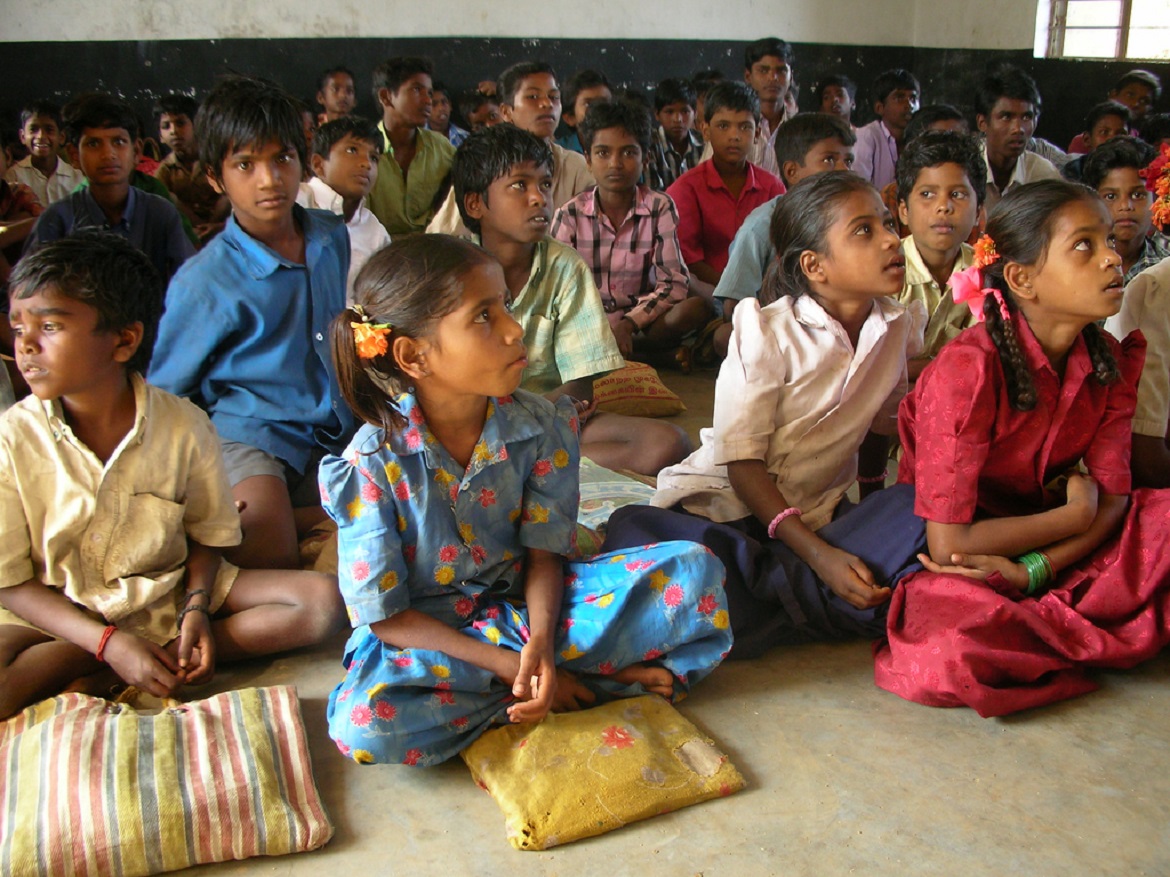 group of kids sitting on the floor