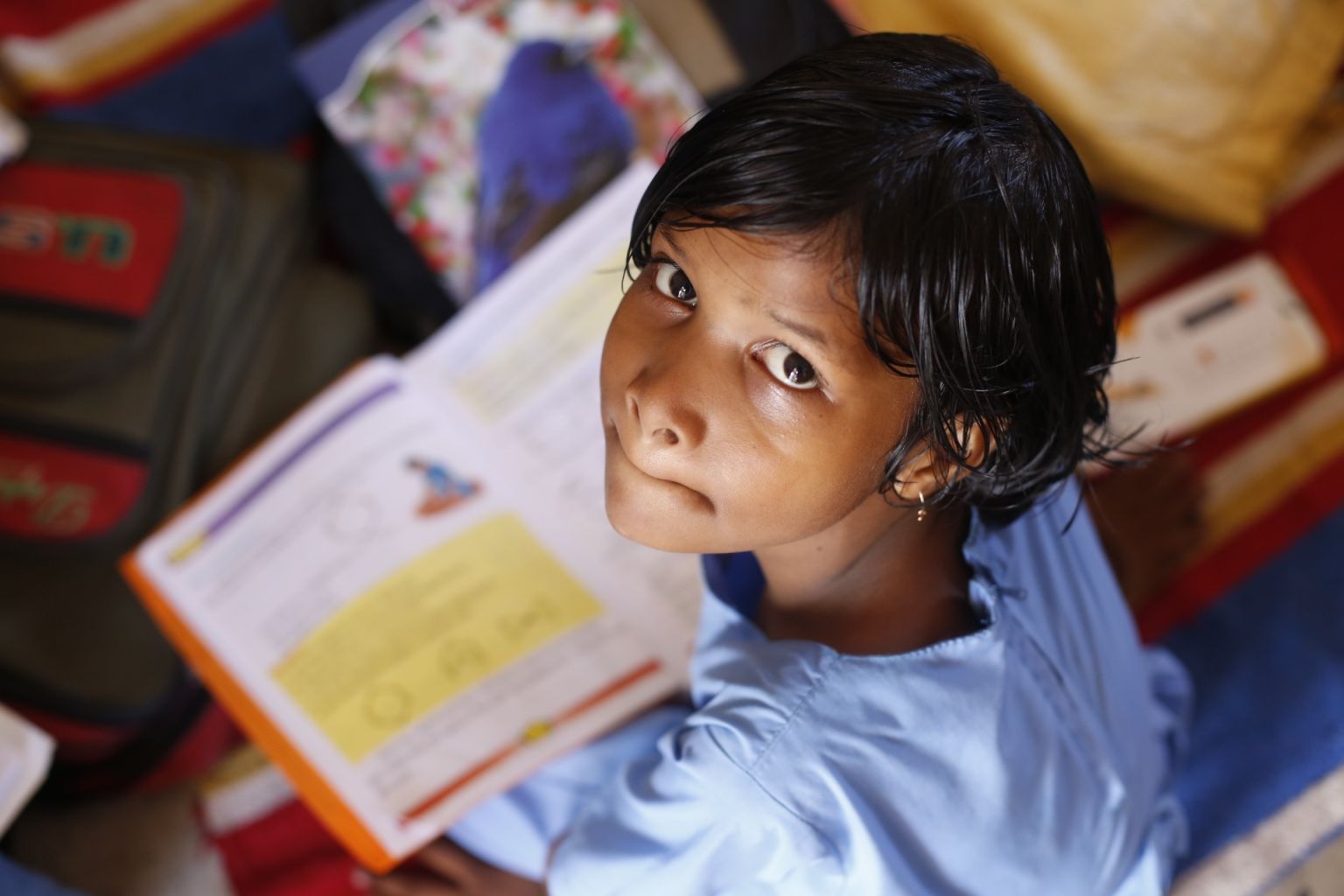 girl reading a textbook -education-rural India-COVID-19_Picture Courtesy: PxHere