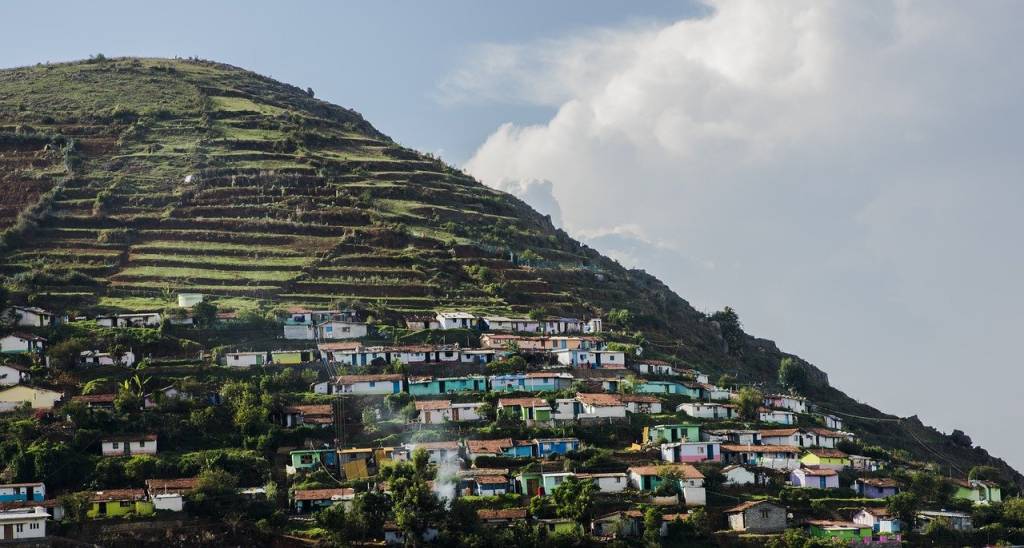 Ooty landscape with houses on the side of a hill-land rights