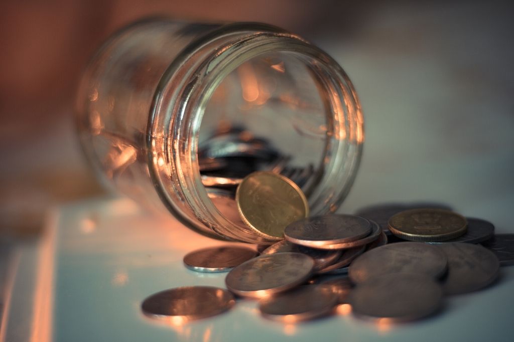 spilled indian coins_social stock exchange_unsplash