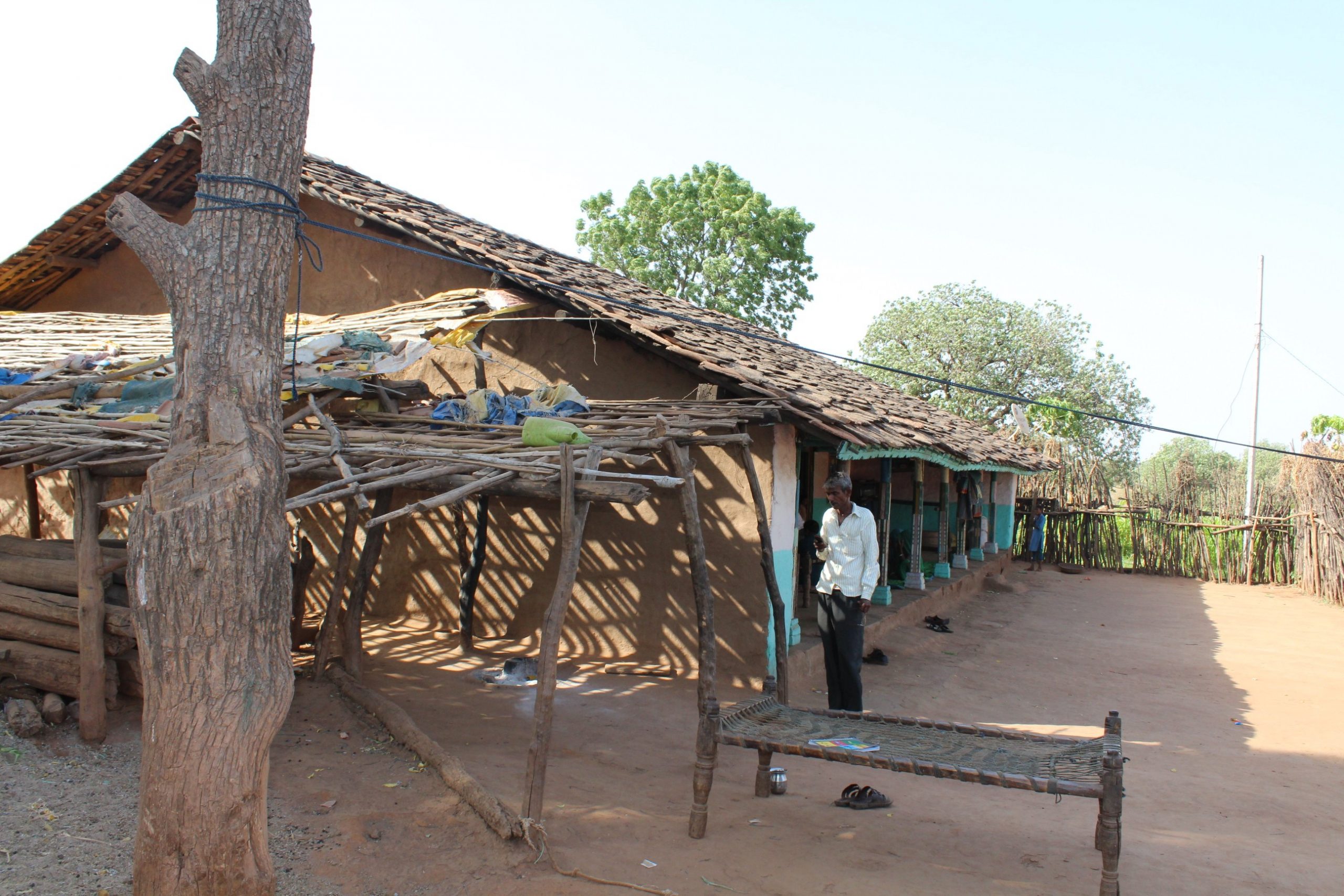 A person standing in front of a structure- systems of local self-government in India