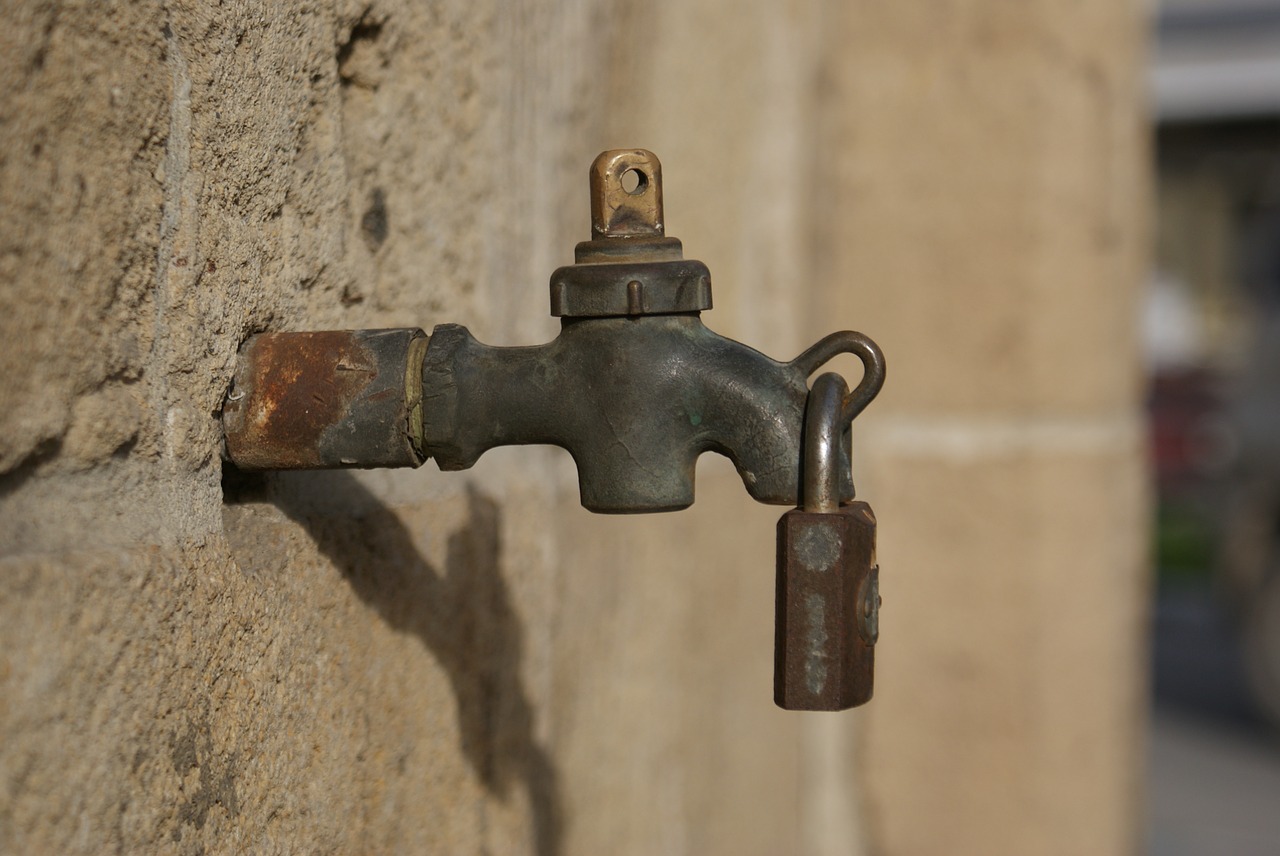 A water tap with a lock on it