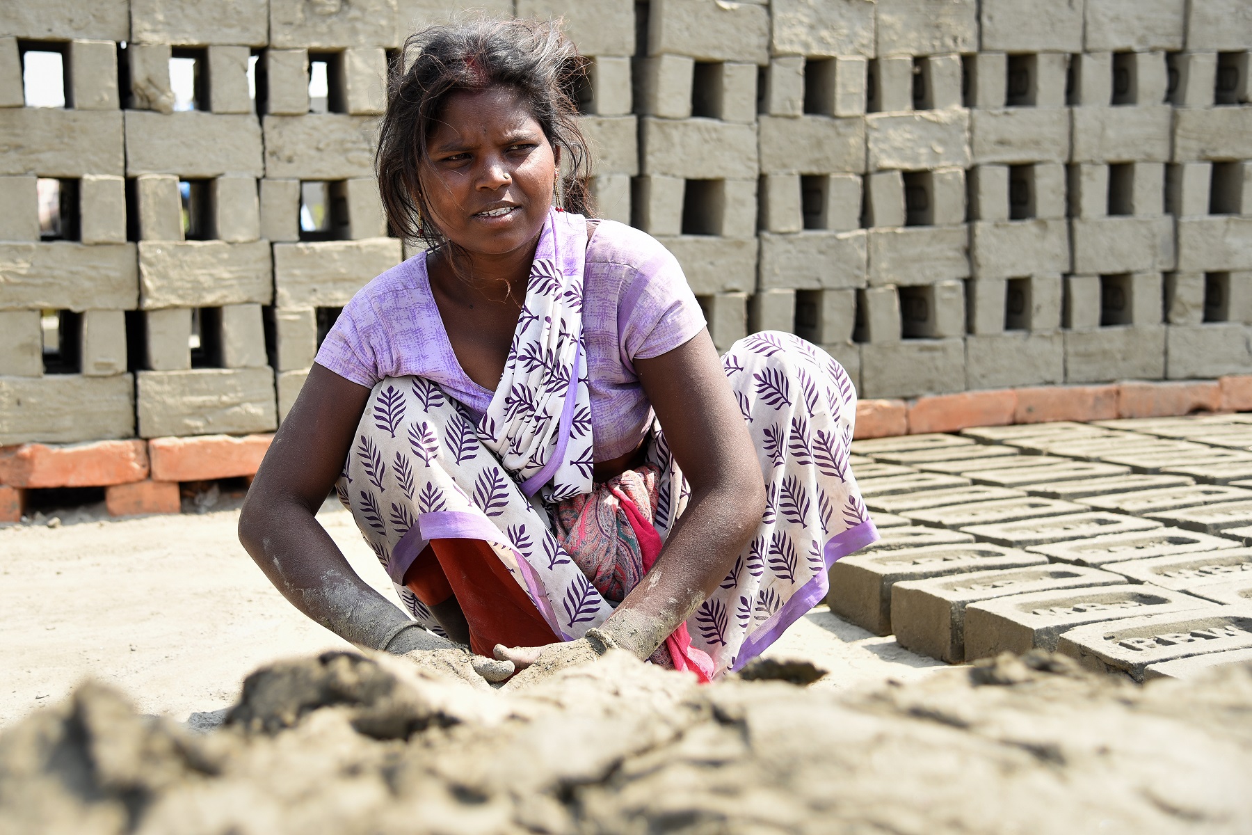 An adolescent Indian girl at a brick kiln