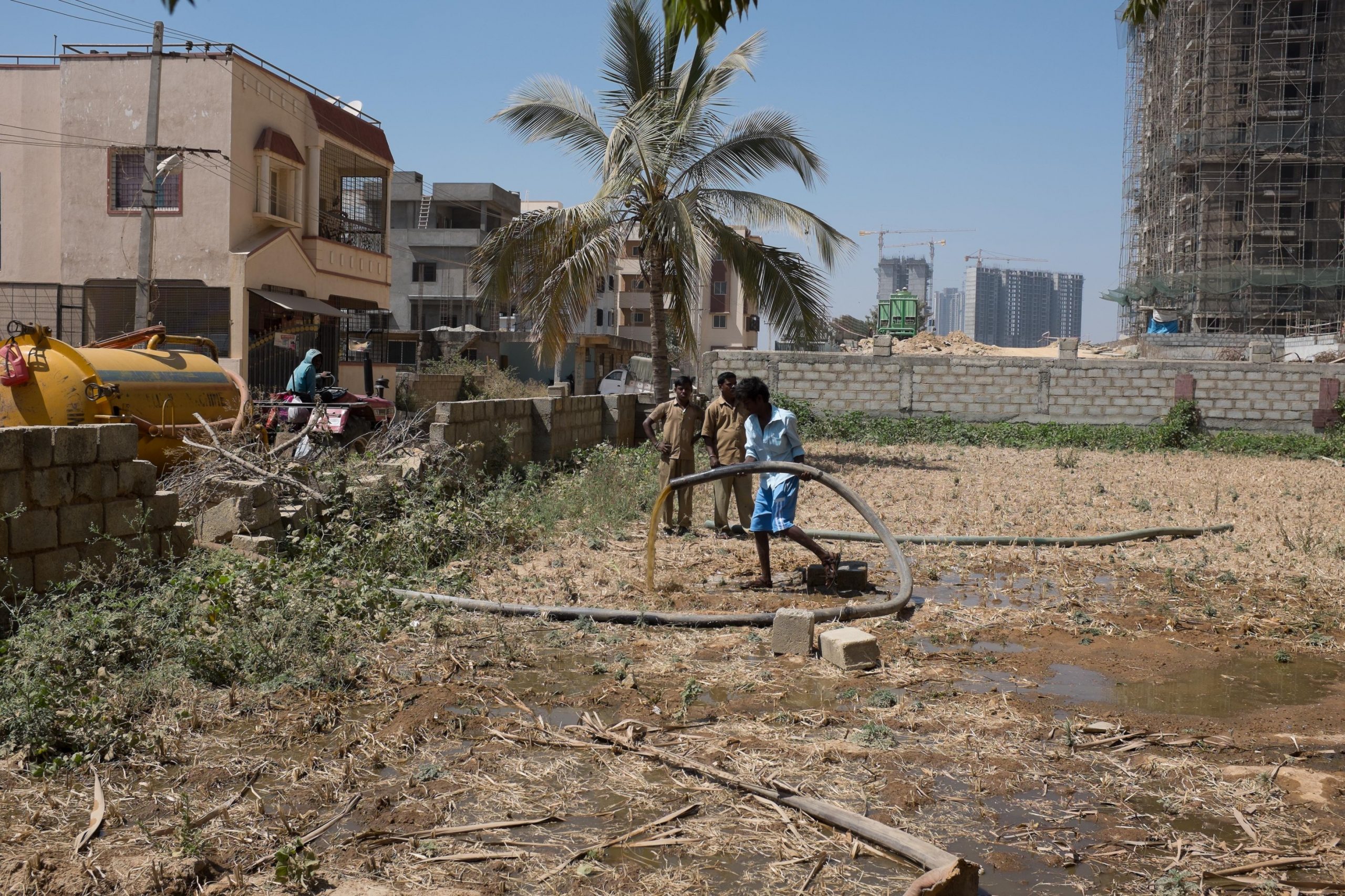 Dumping faecal sludge in open plot_sanitation workers_epw