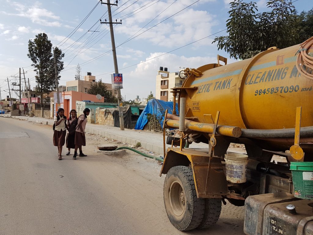 Dumping faecal sludge in drains_sanitation workers_epw