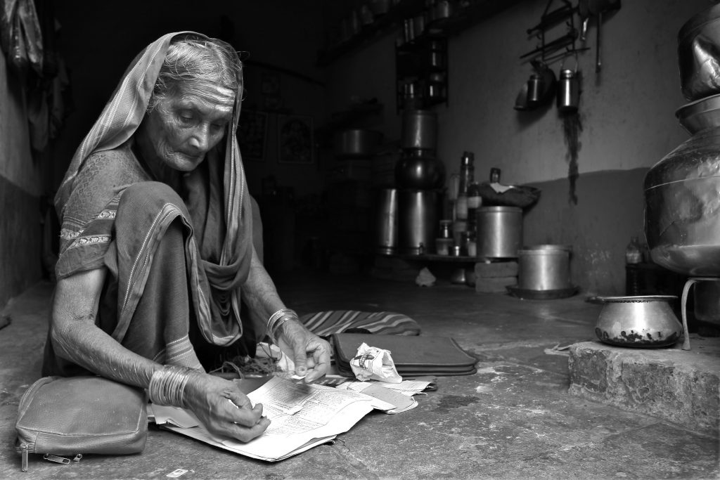 ASwaminathan old Indian woman writing on paper-ageing in india