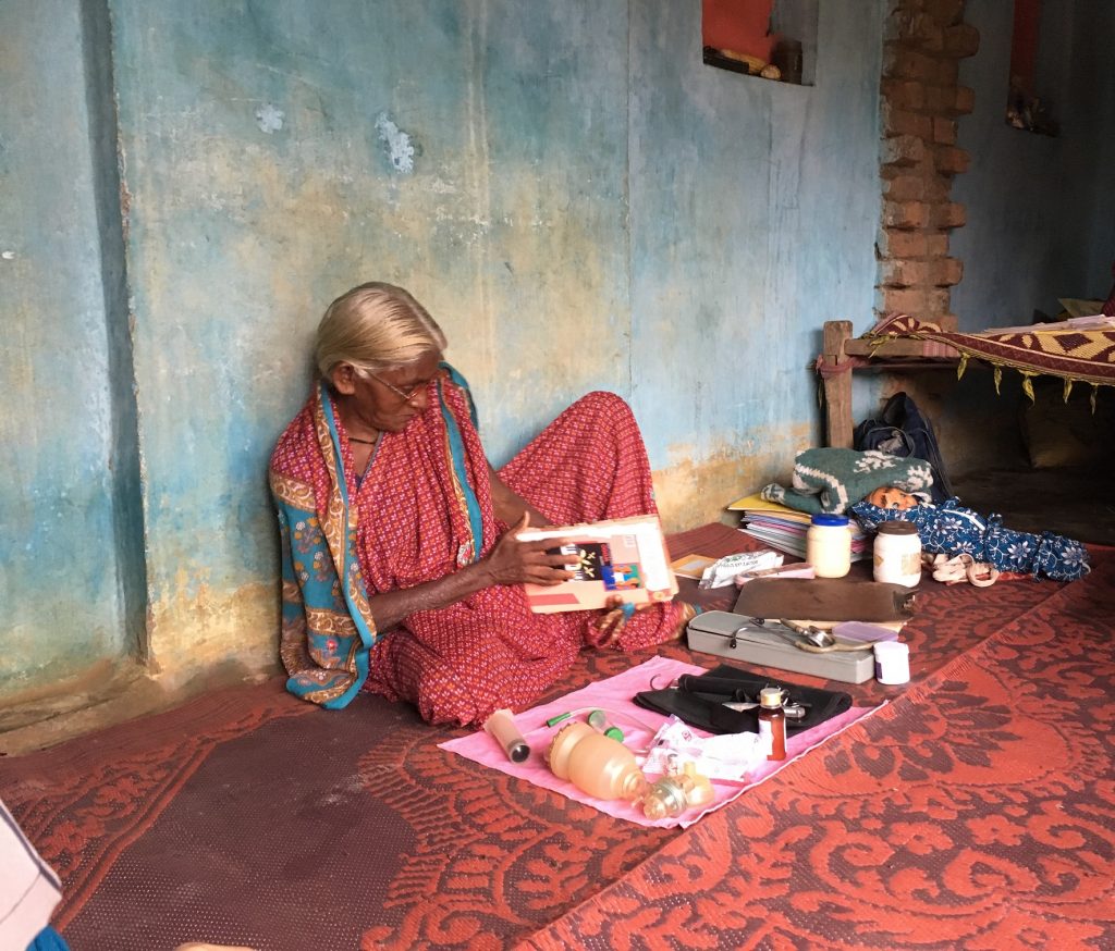 An Adivasi woman with a medical kit 