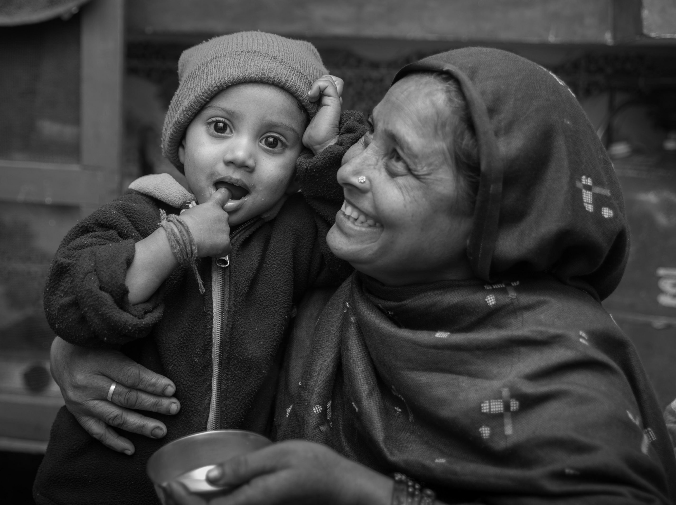 mother smiling and holding child