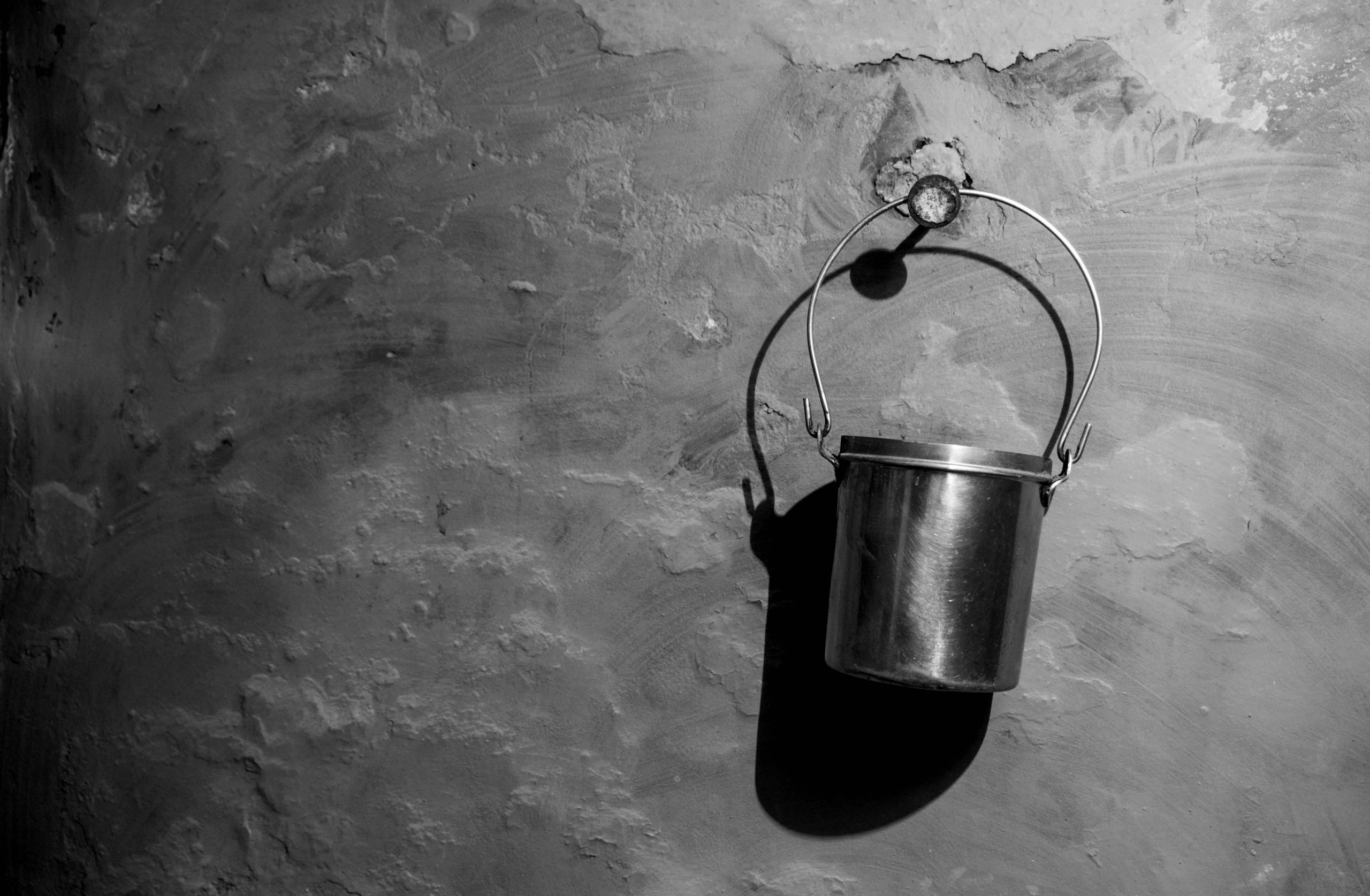 small bucket hanging on wall