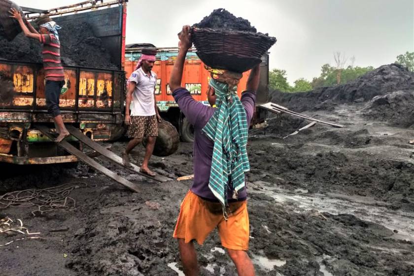 Workers carrying buckets of coal-coal