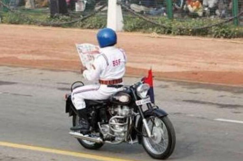 Man sitting backwards on a bike-Republic Day