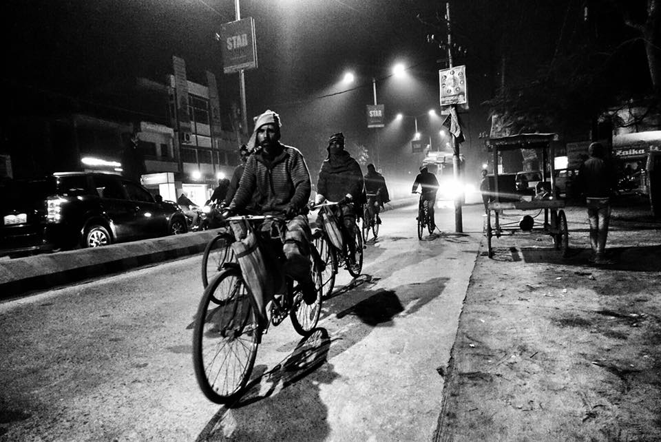 workers on cycles at kathiar junction railway station-migrant workers