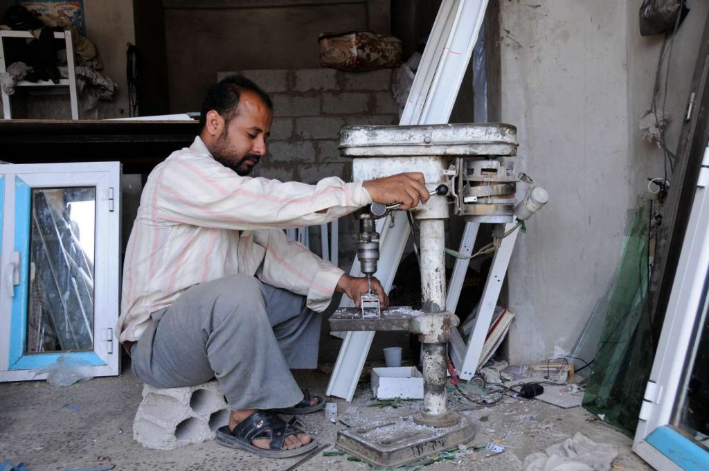 man making window-informal employment