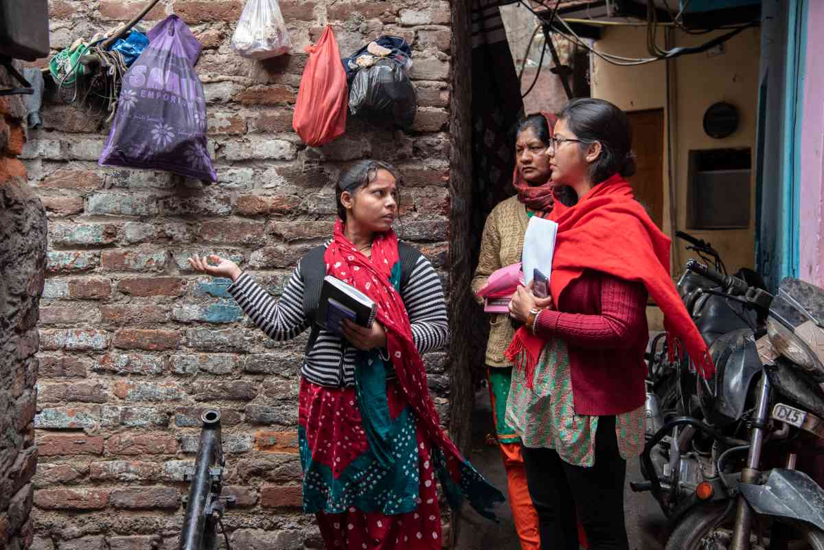 Agents from Haqdarshak, an Acumen investment in Delhi, work in the community to connect eligible citizens to welfare schemes