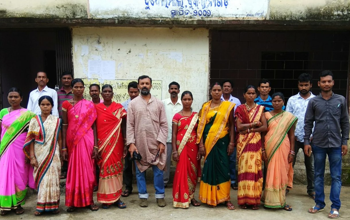 People standing in front of a building-Panchayati Raj Institutions