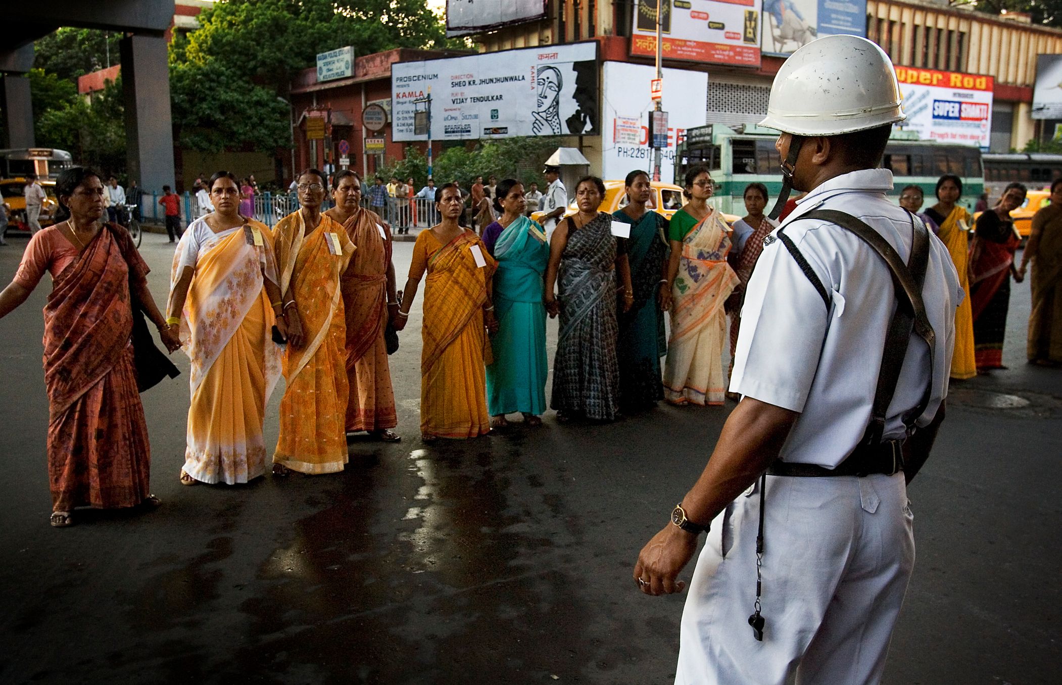 Policeman facing women in a protest march, Calcutta_gender based violence