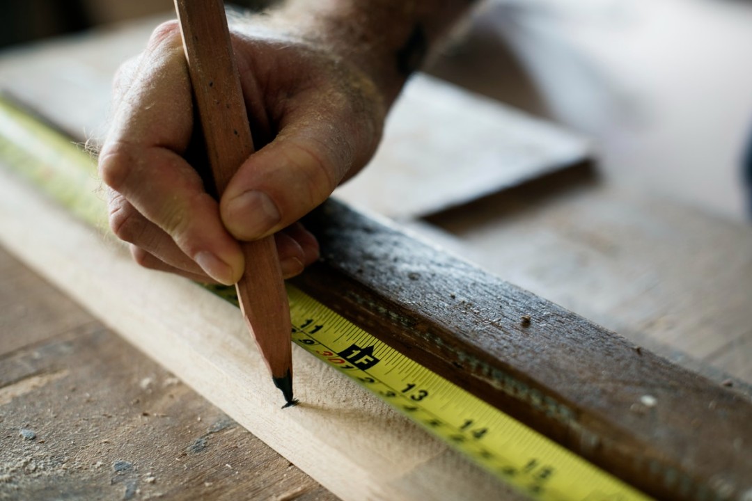 close up of measuring tape near wood_rawpixel