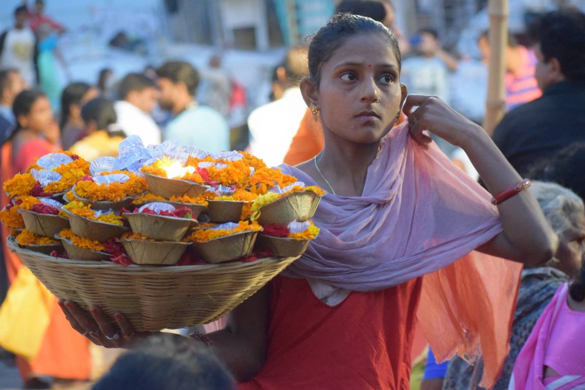 Girl holding a basket of flowers