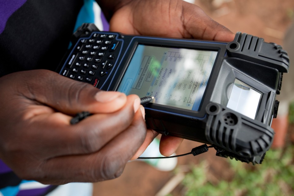 Surveyer using electronic device to gather data