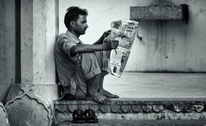 Person reading a newspaper-crimes against women