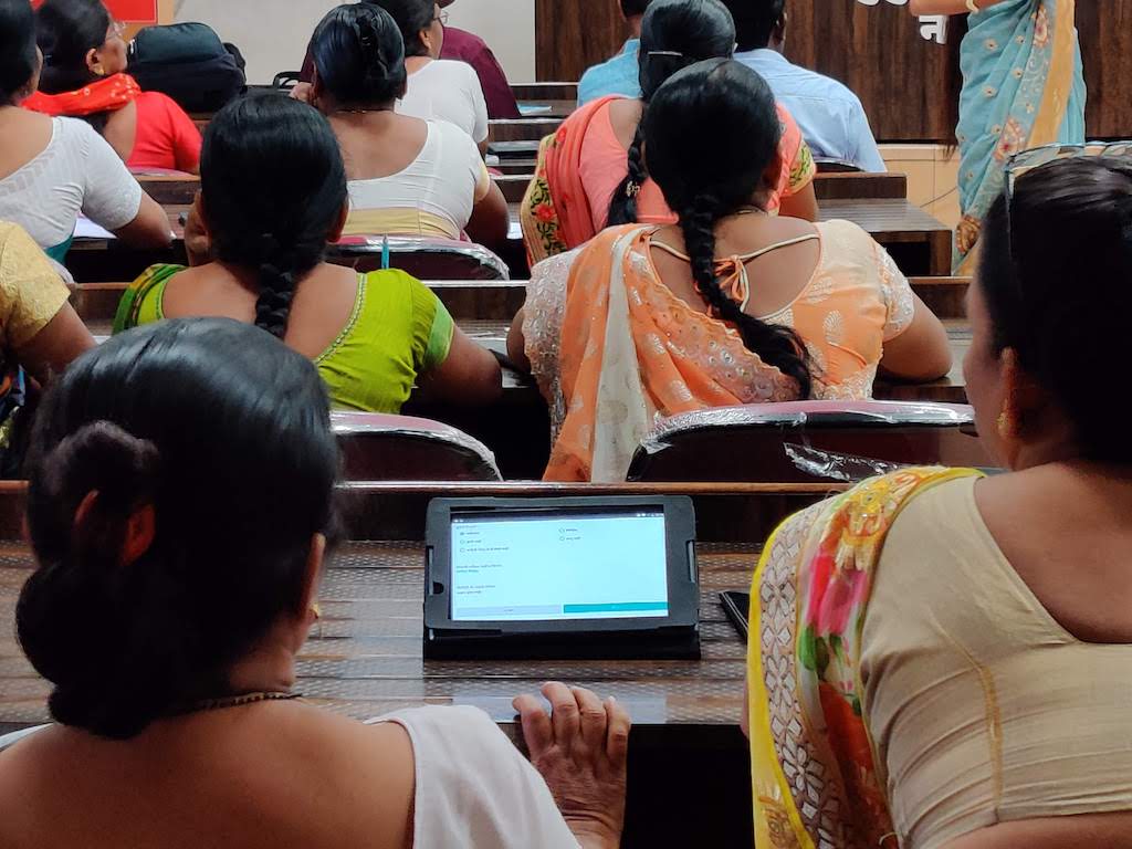 Frontline workers learning about tech in classroom_technology for social good