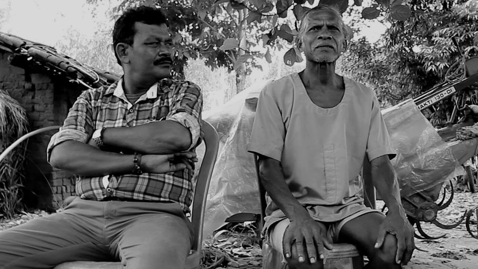 black and white image of the gram pradhan talking about the Bhoodan movement