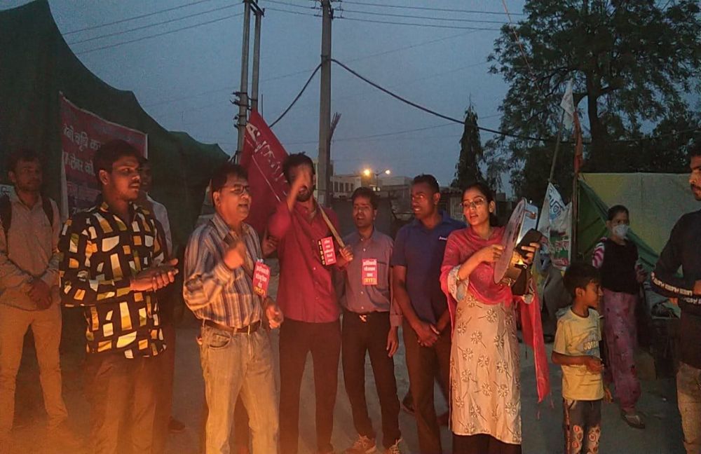 A group of people standing together at a demonstration-Nodeep Kaur