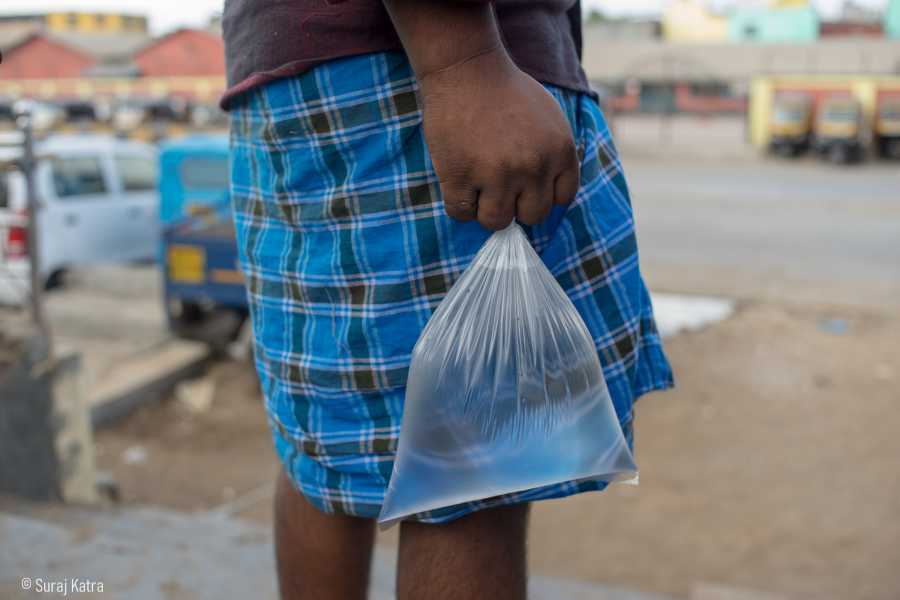 Image 11_ a person holding a clear packet of water-water for all-picture courtesy-Suraj Katra