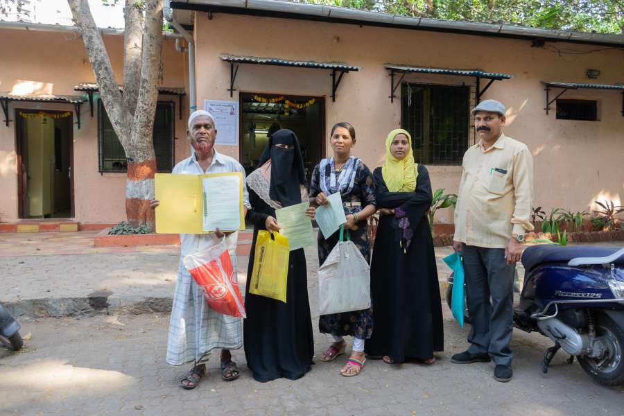 Image 13_people standing next to each other holding documents-water for all_picture courtesy-Suraj Katra
