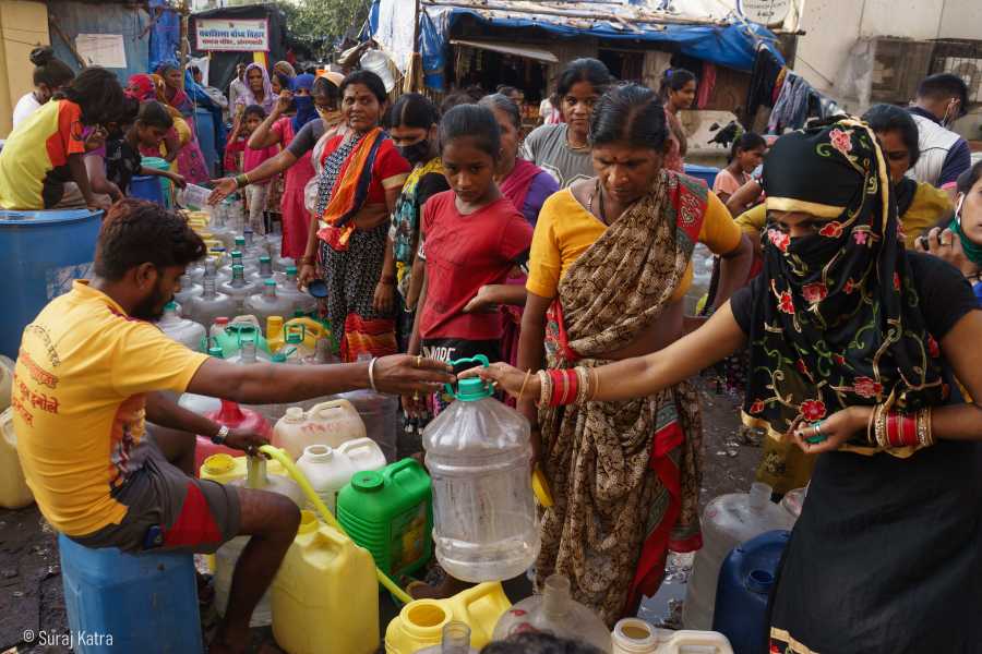 Image 8_people standing in line getting their water filled-water for all-picture courtesy-Suraj Katra