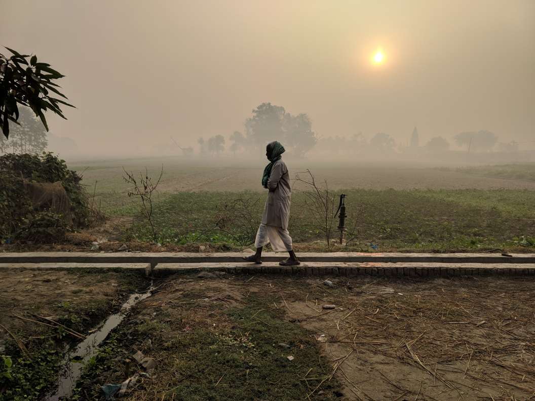 person walking across a field_Pixabay_COVID-19 panchayats