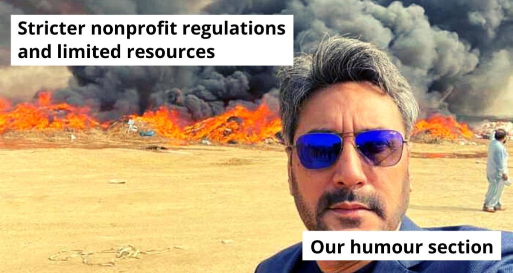 an image of a man taking a selfie as the area behind him is on fire, and is emitting black smoke-nonprofit humour