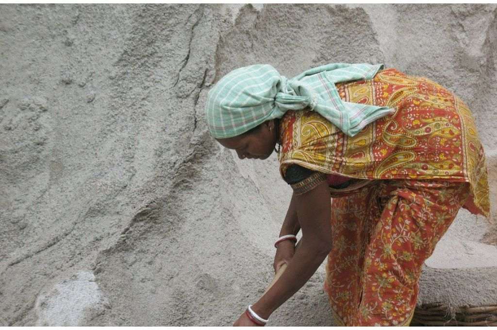 An Indian woman wearing a saree working at a construction site - gender equality